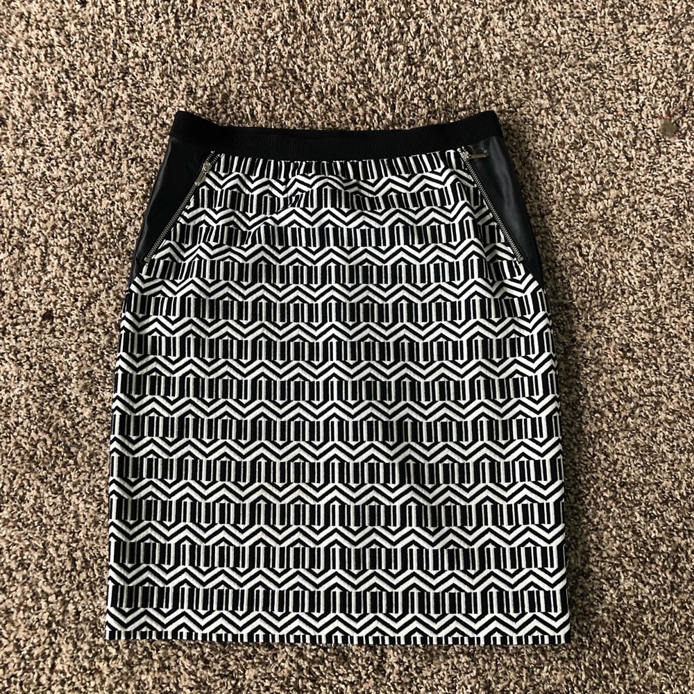 White with black design mini skirt with faux leather detail